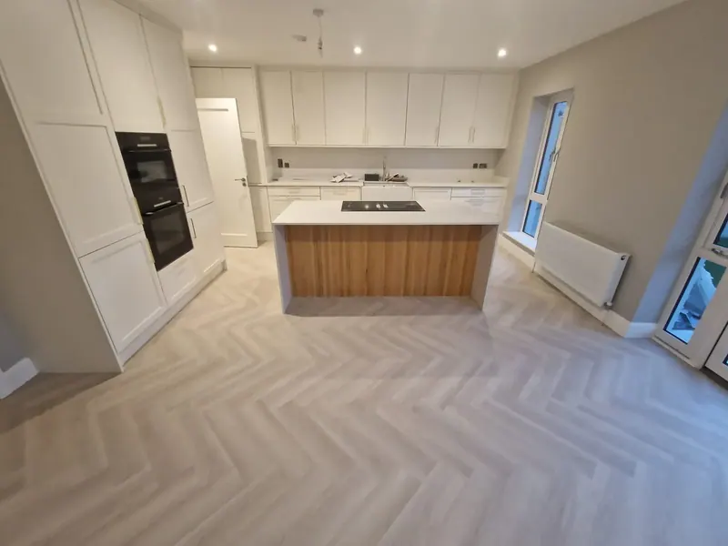 Herringbone floor in a modern kitchen with an island