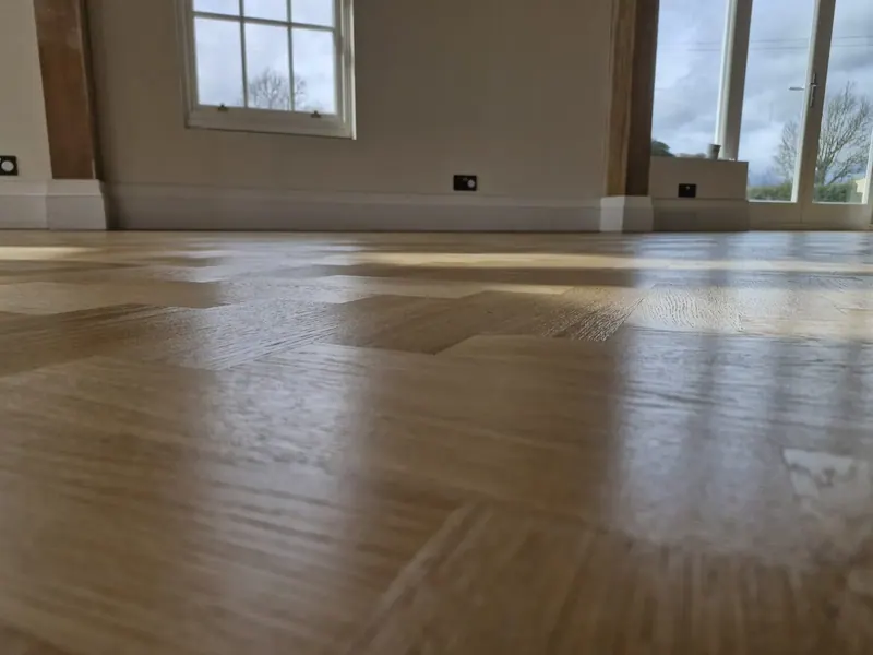Timber floor with a glossy finish catching the light